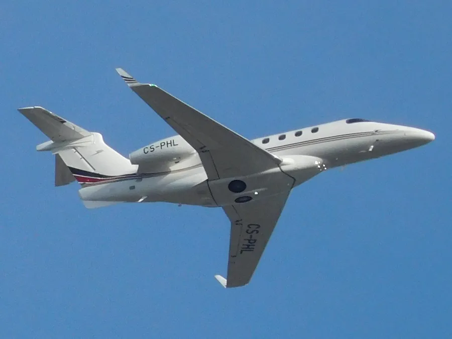 Embraer Phenom 300 light jet in flight